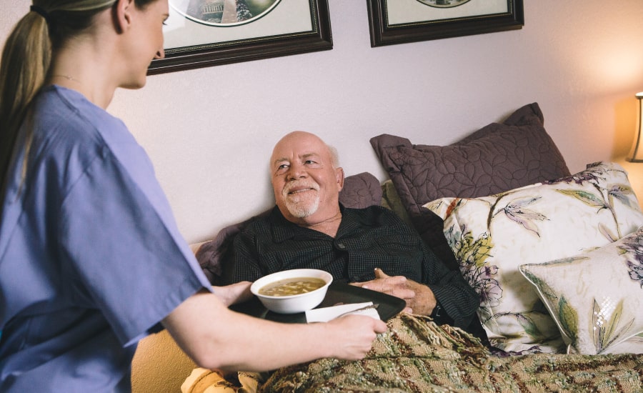 female caregiver taking care of a senior